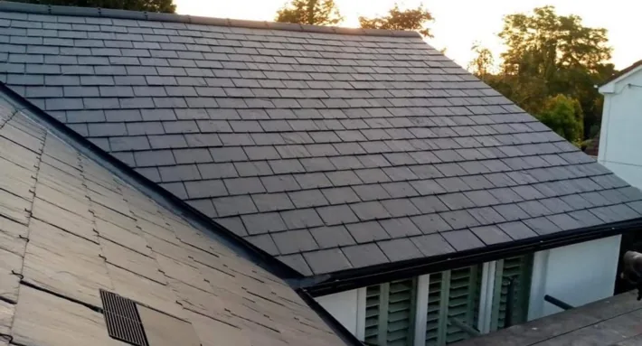A finished slate roof in evening light
